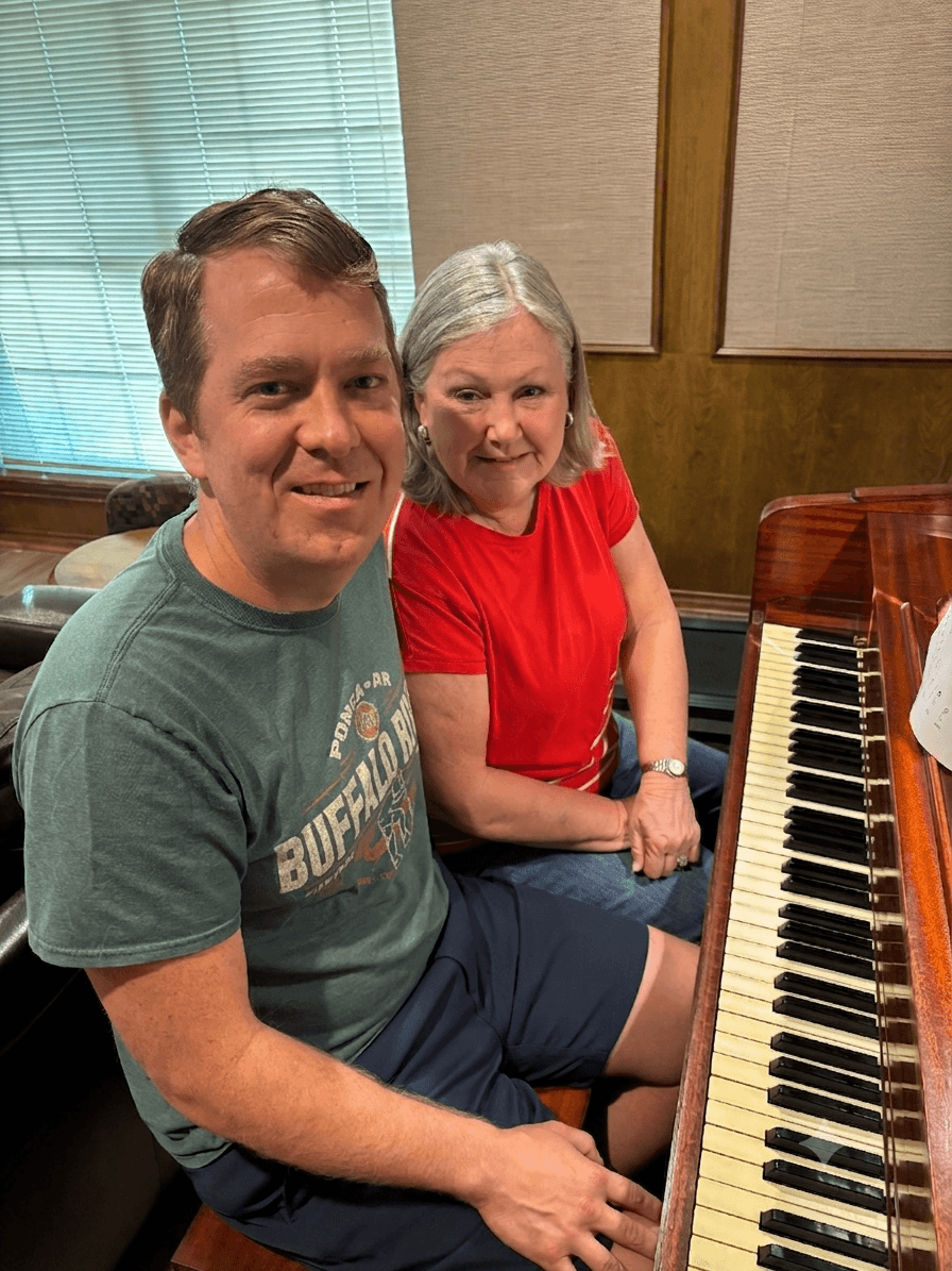 Scott and his mom at the family piano